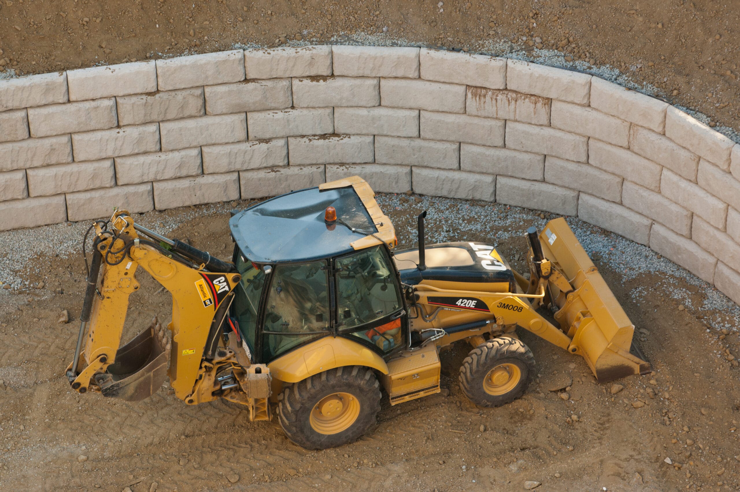 Looking down on a Caterpillar 420 Backhoe/Loader on a construction site